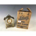 A boxed Schatz brass anniversary clock