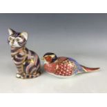 Two Royal Crown Derby paperweights including a sitting cat and pheasant, (both lacking stoppers)