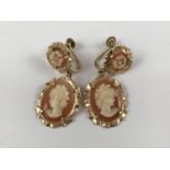 A pair of yellow-metal and shell cameo ear pendants, each depicting the profile of a young lady,