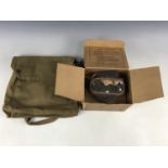 A Second World War civilian gas mask and a General Service respirator haversack
