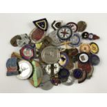 A large quantity of enamelled and other lapel badges