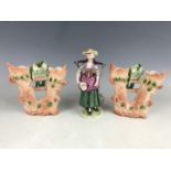 A pair of late 19th century bisque spill vases and a Meissen figurine