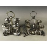 Two late 19th / early 20th century electroplate egg cruet sets
