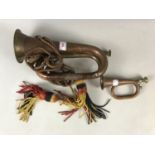 A brass bugle together with a miniature brass bugle