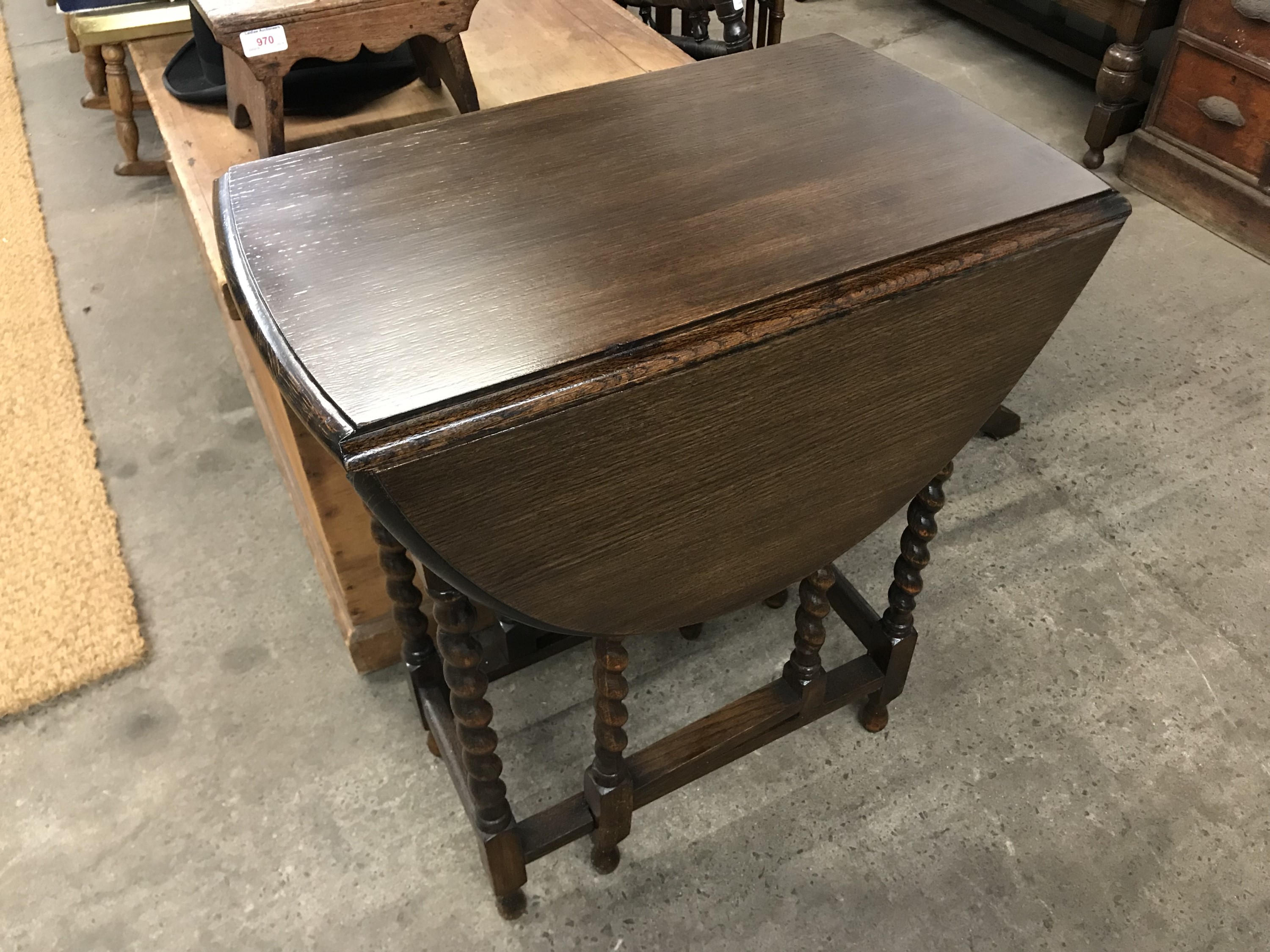 A small 1920s oak drop-leaf occasional table