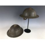 Two Second World War British army Mk 2 helmets