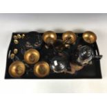 A Chinese lacquered tea set with tray