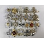 A quantity of British Army Staybright and other cap badges