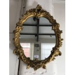 A Rococo style gilt framed wall mirror, 65 x 48 cm