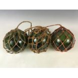 Three glass fishing floats