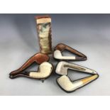 Four of meerschaum pipes, to include a boxed Jambo pipe