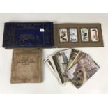 Early 20th Century ephemera including cigarette card albums and postcards