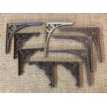 Five (three and two) period Gothic style cast-iron shelf brackets together with four others