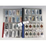 A quantity of Royal Navy themed cigarette cards etc
