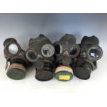 Four Second World War civilian duty gas masks