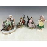 A Dresden figural group together with a pair of Capodimonte figurines etc