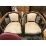 A pair of Sheraton revival period string-inlaid mahogany horseshoe-back open armchairs