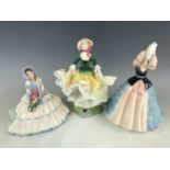 Three Royal Doulton figurines including Becky HN2740, Susan HN2952 and Daydreams HN1731