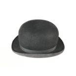 A Dunn & Co bowler hat, size 7 and 3/4