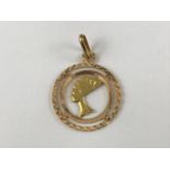 A contemporary Egyptian high carat yellow-metal (stamped 750 and tested as gold) annular pendant