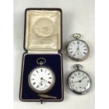 A cased silver pocket watch together with one other silver pocket watch and a Smiths chrome plated