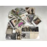 A quantity of early 20th Century sentimental postcards, to include RSPCA charity cards, and