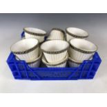 A set of twelve candle light shades trimmed with blue braiding, 11 x 14 cm diameter