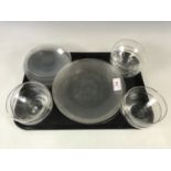 Eight free-blown glass bowls with corresponding hand blown plates, second quarter of the 20th
