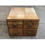 A set of mid 20th Century blonde oak card index filing drawers