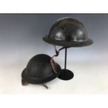 Two Second World War Plasfort helmets
