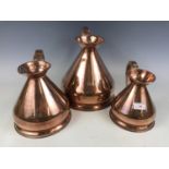 Three copper measures including one gallon, a half-gallon and quart