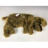 A 1940s pyjama case in the form of a slumbering dog