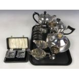 A quantity of electroplate, including a three-piece tea service, a muffin dish, a toast rack, and