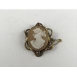 A late Victorian gilt-metal and shell cameo brooch, depicting the profile of Greek goddess Selene,