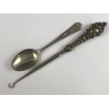 A Victorian silver-handled button hook, and a vintage child's Donald Duck spoon