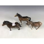 A Beswick horse, Shetland pony and donkey