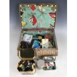 A 1950s rattan sewing casket and contents, comprising assorted sewing equipment and supplies