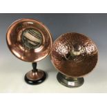 A vintage Cosmos copper heat lamp and one other