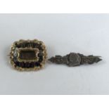 A Victorian yellow-metal mourning brooch, having a black enamelled frame bearing the inscription 'In