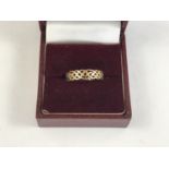 A 9ct gold Celtic influence dress ring, having a plaited openwork face, 1.2g