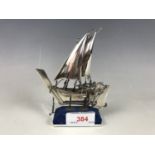 A white metal miniature Arab dhow