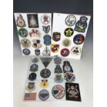 A collection of American cloth squadron badges