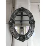 A period Mexican tramp-art style wrought tin plate wall mirror, 36 x 60 cm