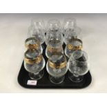 Six large crystal brandy glasses together with six smaller glasses