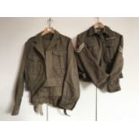 A post war Malta artillery battle dress blouse with trousers together with a Second World War