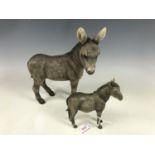 Two donkey figurines
