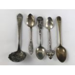 A Canadian Metal Arts Guild white-metal tea spoon by George Dancy, having a bifurcated terminal