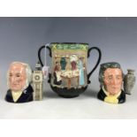 A Royal Doulton 'Pottery in the Past' loving cup together with two Royal Doulton character jugs