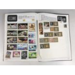 A mid 20th Century album of GB and world stamps