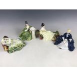 Four Royal Doulton figurines including Secret Thoughts HN2382, Laurianne HN2719, Solitude HN2810 and